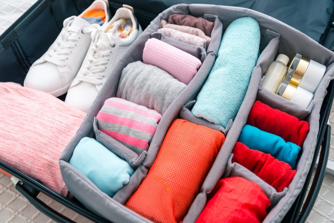 Neatly Folded Clothes In A Suitcase